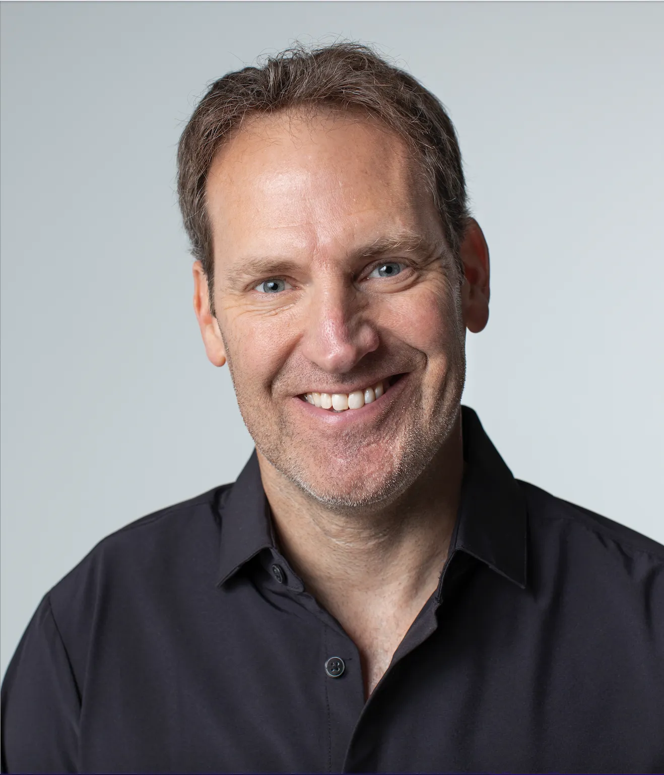 VML Global CEO Jon Cook, wearing a black button-up shirt