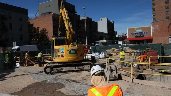 Workers are seen on the construction site of the Second Avenue Subway station
