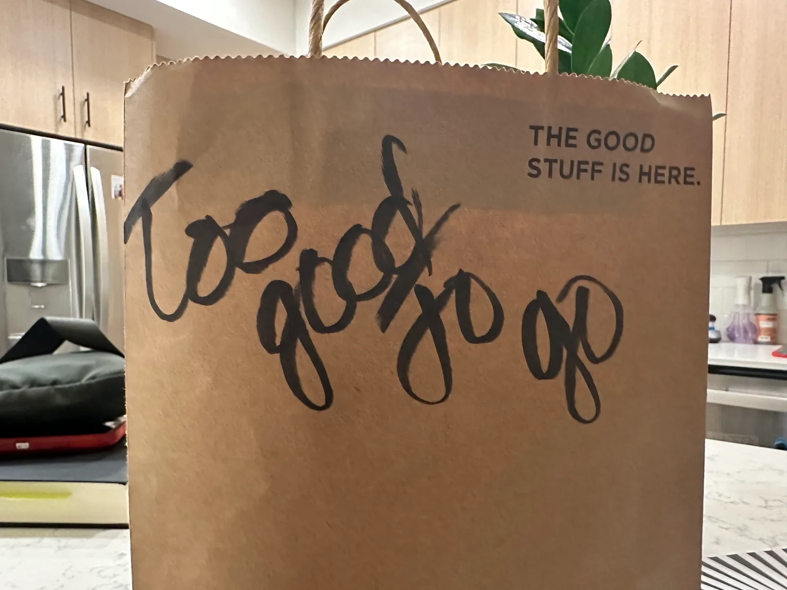 Brown paper bag that has "Too Good To Go" written on it