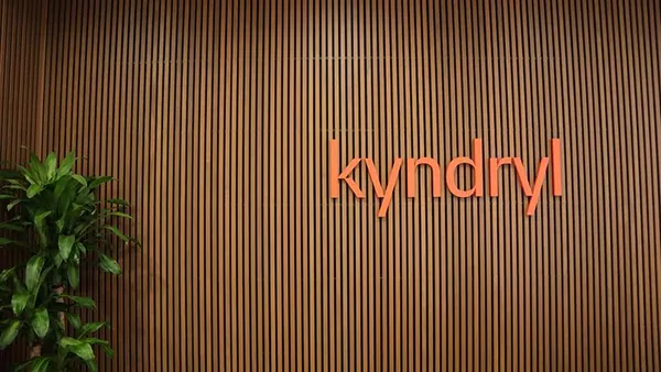 Kyndryl logo pictured on a wall inside the infrastructure services company's building.