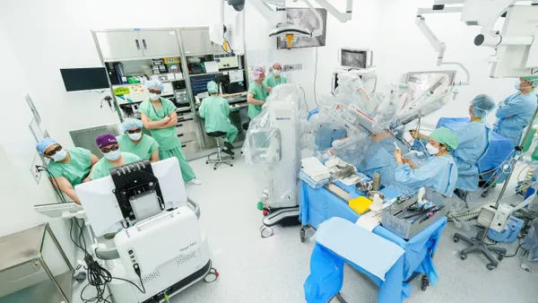 Medtronic's Hugo robotic surgery system is shown in an operating room in Seoul, South Korea, with a surgical team.