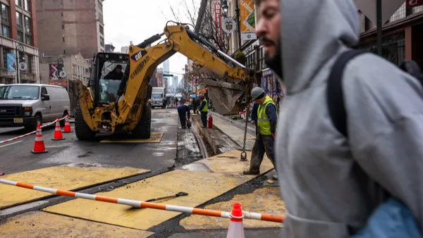 Construction workers at a construction site on a street in Manhattan