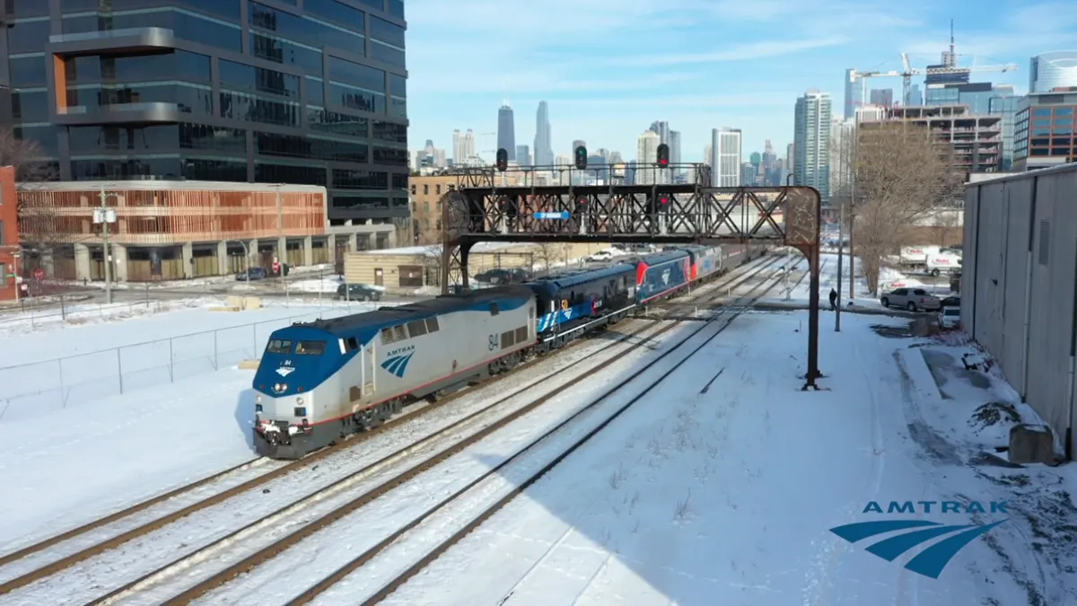 Amtrak "Empire Builder" train leaving snow-covered Chicago.