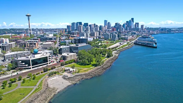 Aerial shot of waterfront parks and city skyline