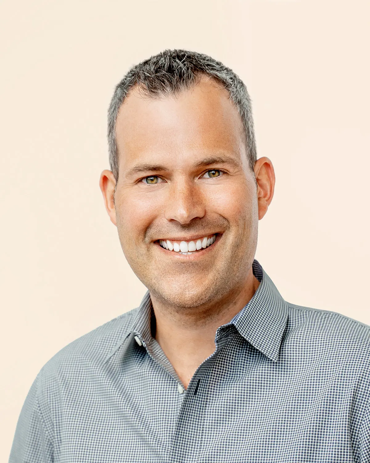 A professional headshot.