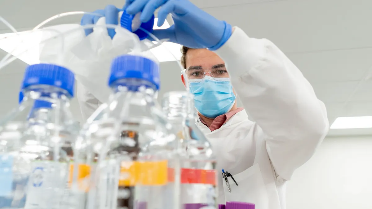 Male working in a lab.