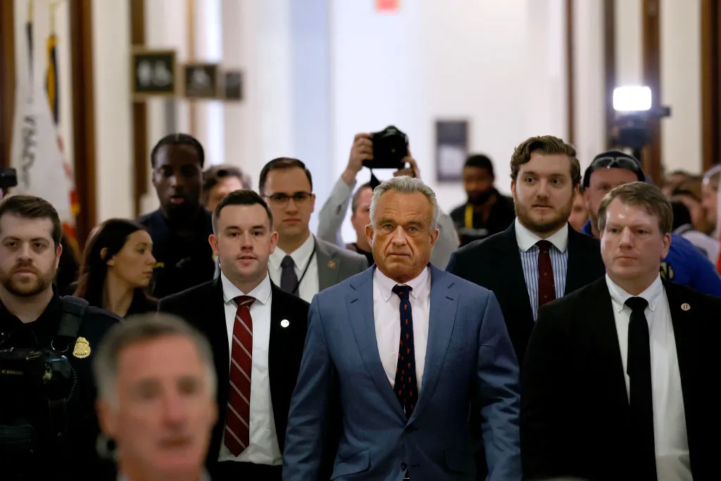 RFK Jr. strides down a Capitol Hill hallway thronged by aides and reporters.