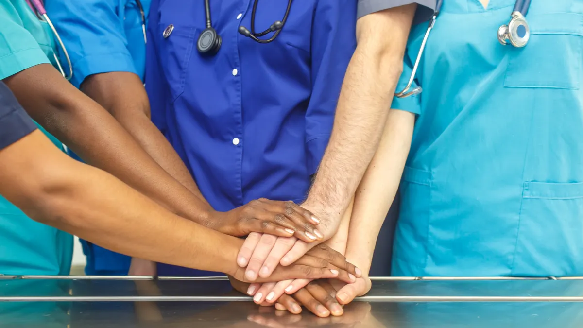 Healthcare workers holding hands