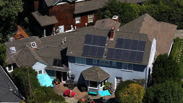 In an aerial view, solar panels are seen on the roof of a home on June 03, 2025 in San Anselmo, California.