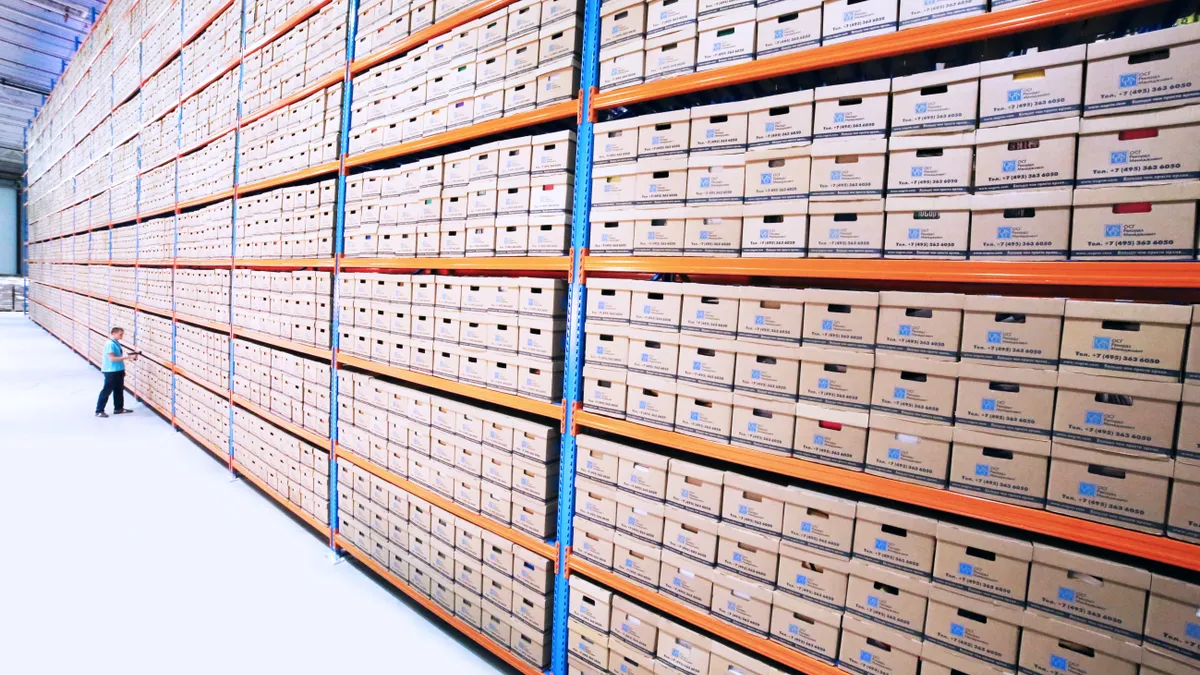 Boxes stored on wooden cabinet in warehouse