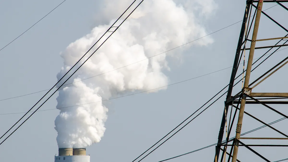 Steam billowing from a coal-fired power plant's smokestack.