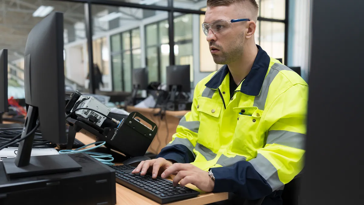 An engineer takes a training course on a computer.