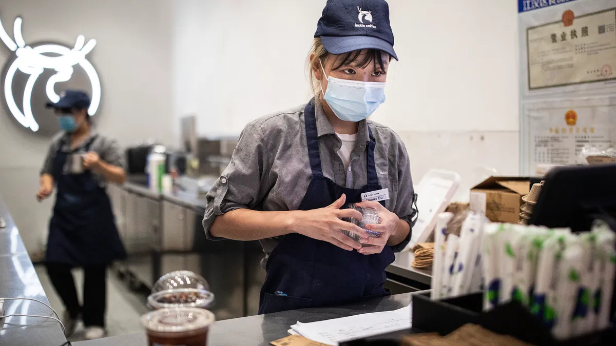 Barista at Luckin Coffee shop.