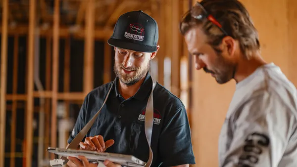 Man talking to a construction worker