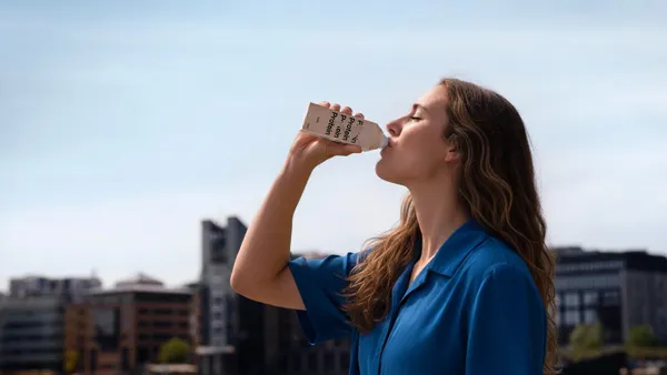 Person drinking a protien drink