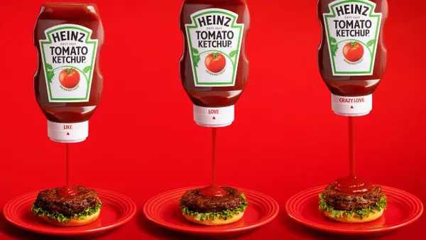 Three bottles of Heinz ketchup being squeeze by hands, with different volumes of product flowing out of each one.