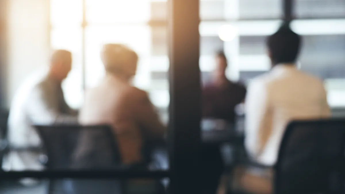 Business people, meeting and corporate discussion against a blurred background at the office. Group of employees in team planning, presentation or training staff for collaboration.