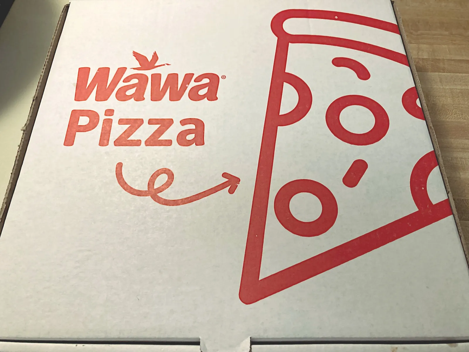 A photo of Wawa pizza in a box.