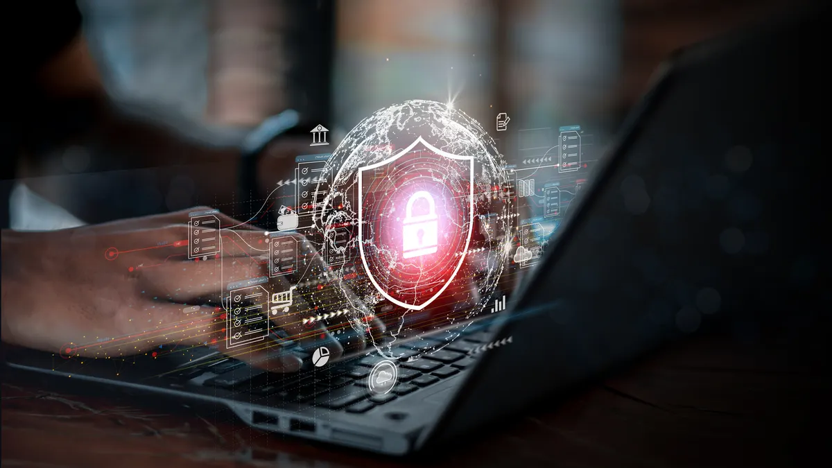 Businessman working on laptop with virtual screen