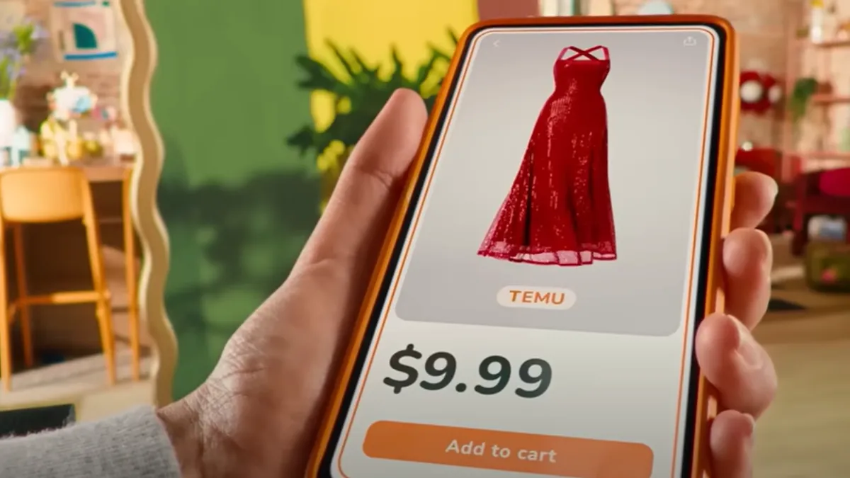 A person is holding a phone displaying the Temu app, where a red dress is sold.