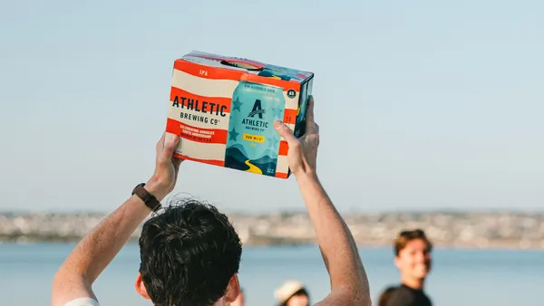 Man holds case of Athletic