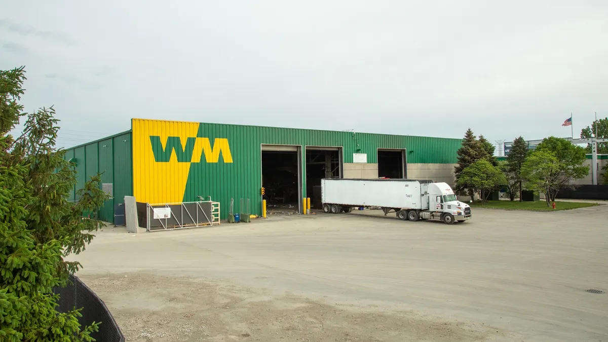 Industrial facility with WM logo and semi-truck