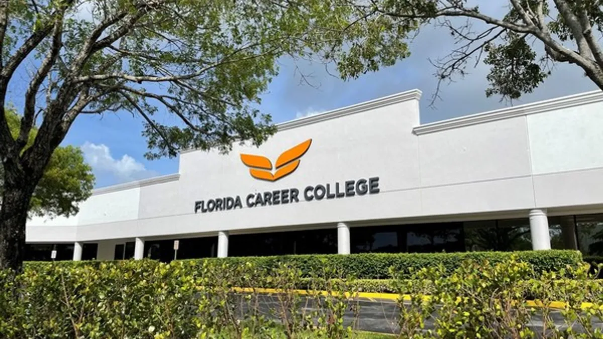 A close up of a building with the Florida Career College logo on it.