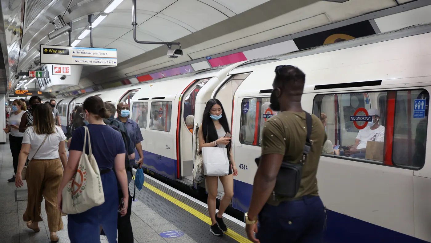 Commuters and shoppers opt to continue wearing face coverings on the London Underground system despite it no longer being enforced.