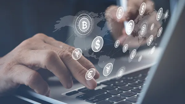 Closeup shot of a group of unrecognisable businesspeople going through paperwork together in an office.