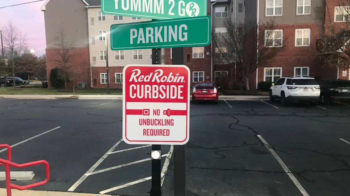 A picture of Red Robin's curbside/to-go parking sign