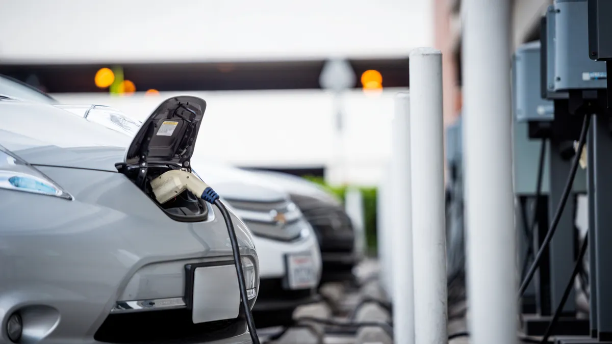 Electric vehicles at an EV charging station.