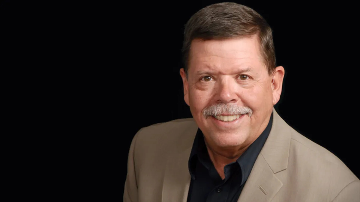 A headshot of Jim Creel, CEO of Taco John's.