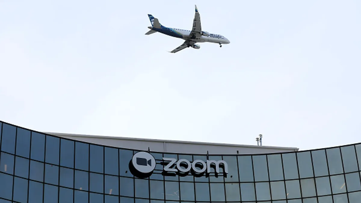 A sign is posted on the exterior of Zoom headquarters on February 07, 2023 in San Jose, California.