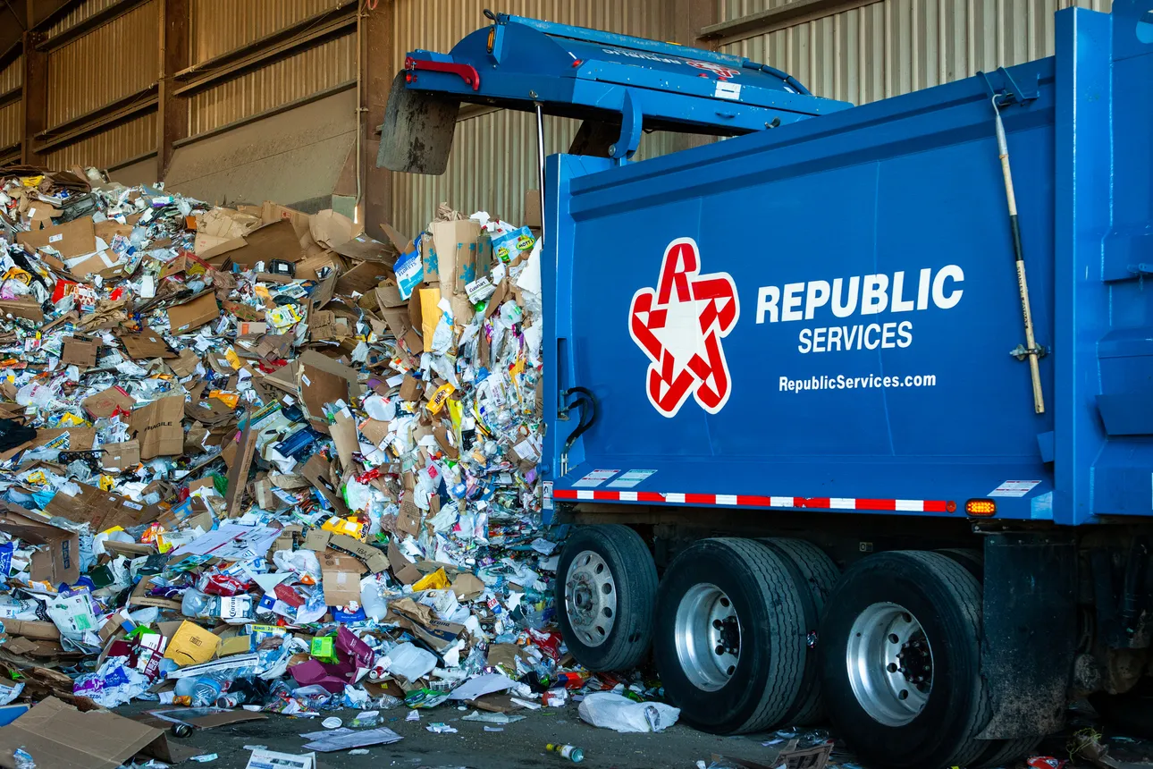 Republic Services truck tipping load of recyclables