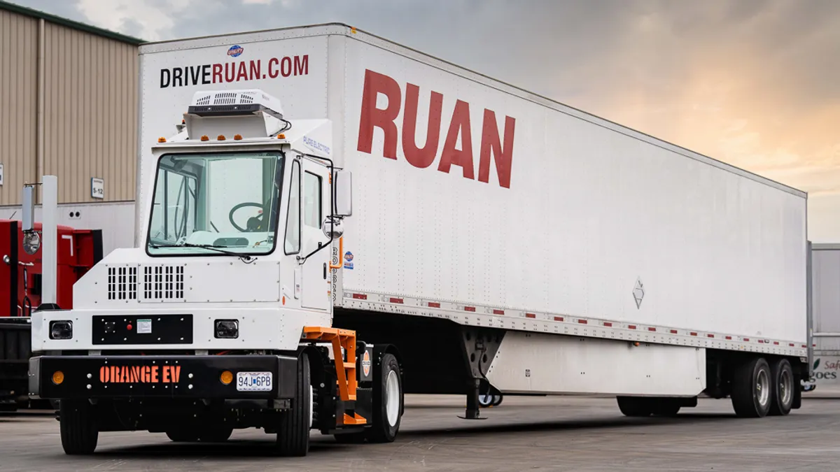 Orange EV electric truck with Ruan trailer.