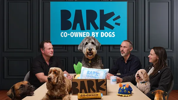 dogs and human at a table