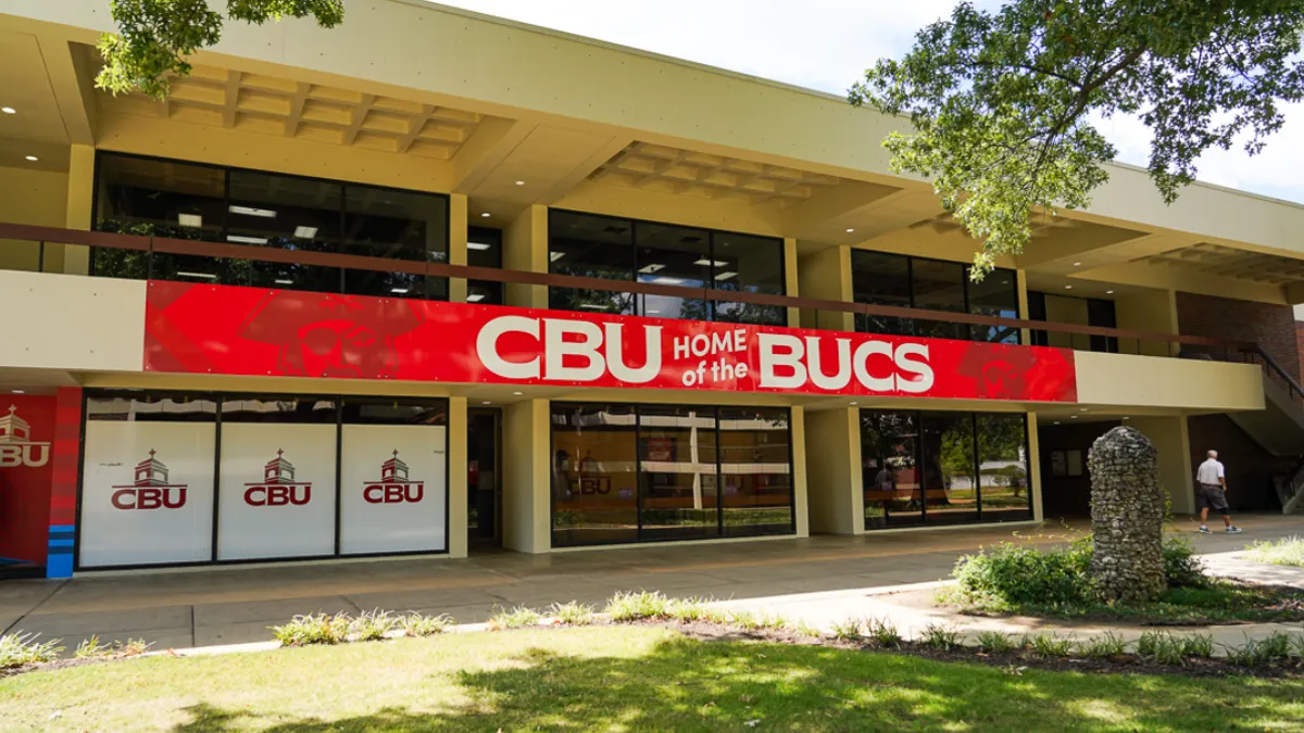 Campus building with exterior sign reading "CBU home of the BUCS."