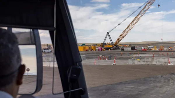 The Oklo Aurora Powerhouse construction site is shown from a bus at the Idaho National Laboratory