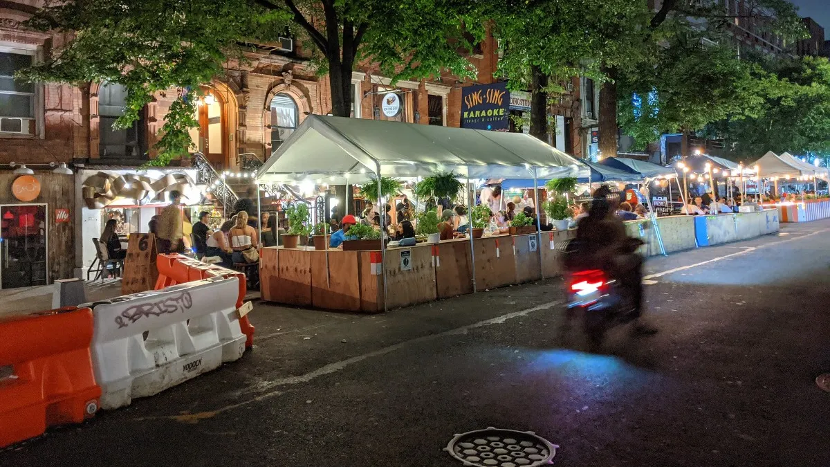 Diners eat at St. Marks Place in New York City during the coronavirus pandemic in 2020.