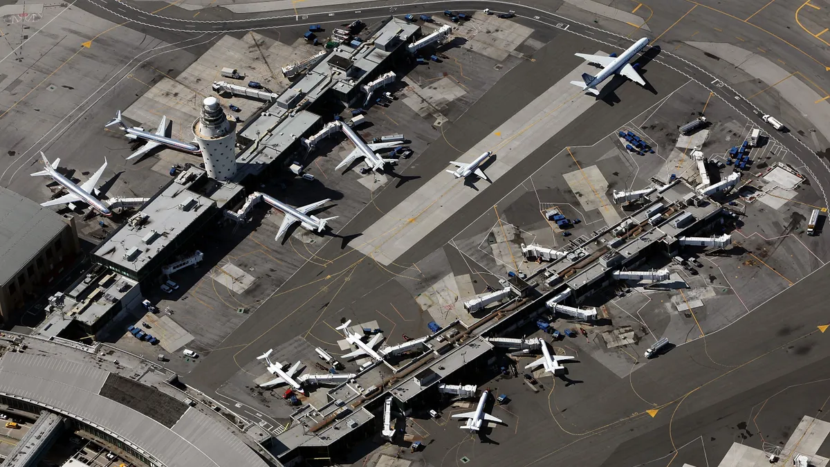 Aerial view of planes and airport infrastructure.