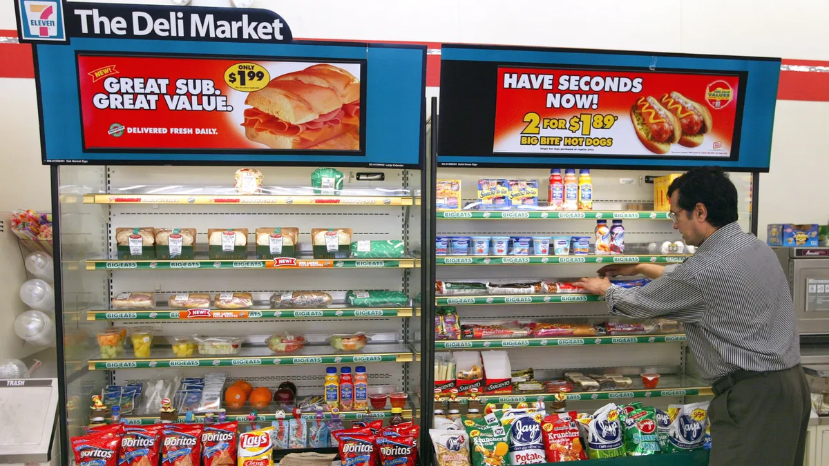 Person fills 7-Eleven Deli Market