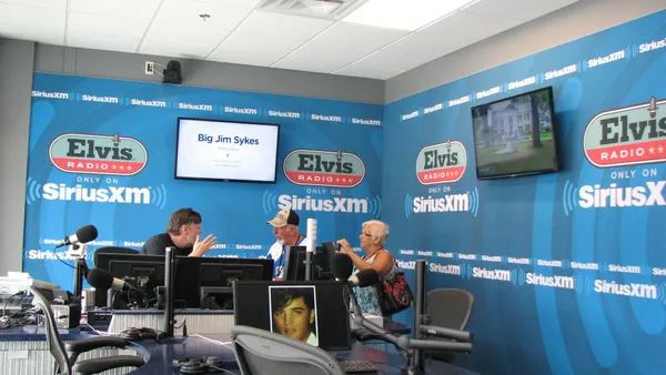 People sit in a radio studio.