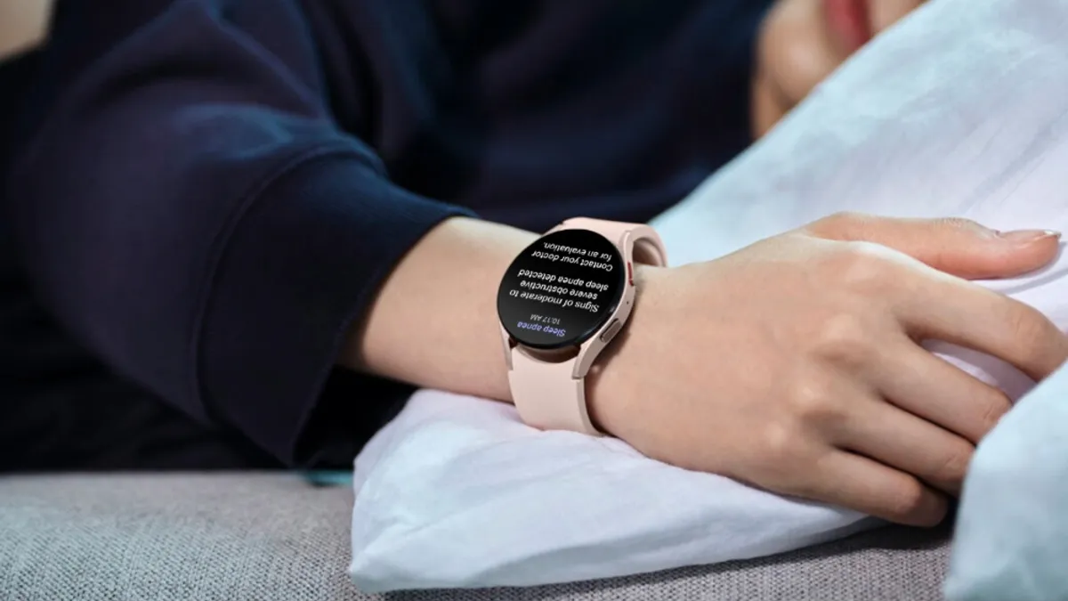 Close up of a watch on a person's wrist that says "sleep apnea 10:17 am"