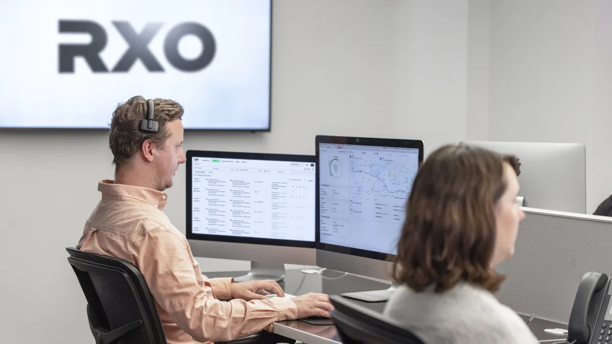 RXO staff working in an office on computers.