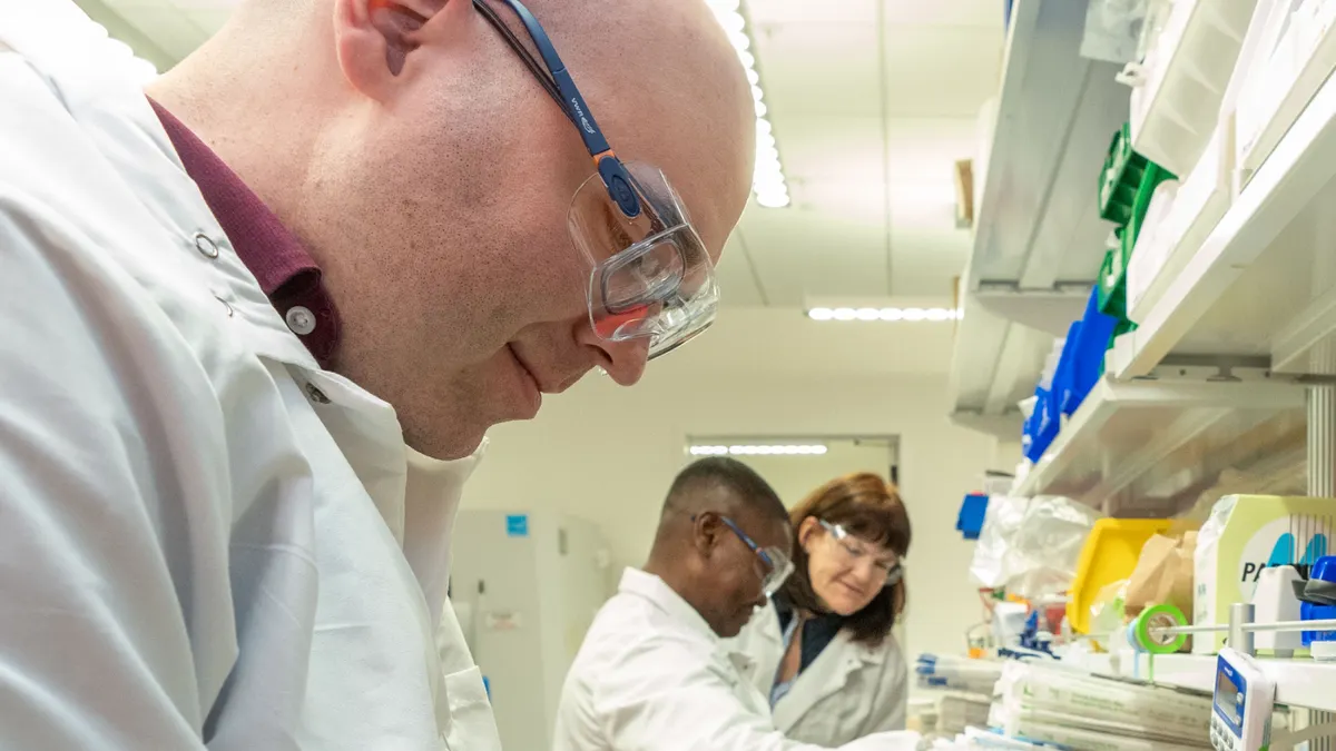 Renasant Bio researchers work in the biotech's lab.