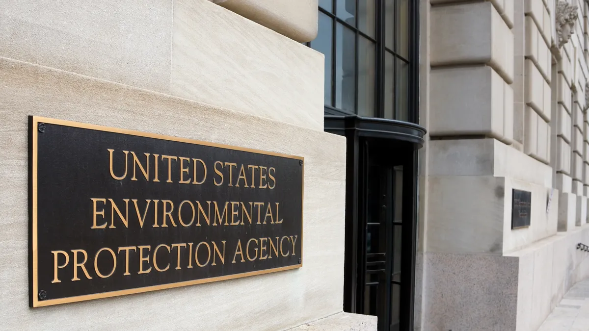 A close-up angular view of a government building in Washington, D.C. with a sign reading "United States Environmental ProtectionAgency"