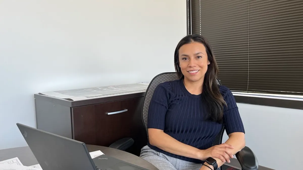 a woman sitting at a desk