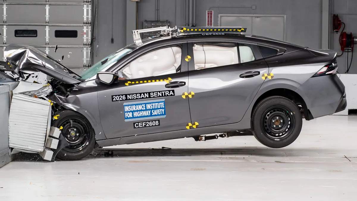 A gray 2026 Nissan Sentra undergoes moderate overlap front crash test by the Insurance Institute for Highway Safety.