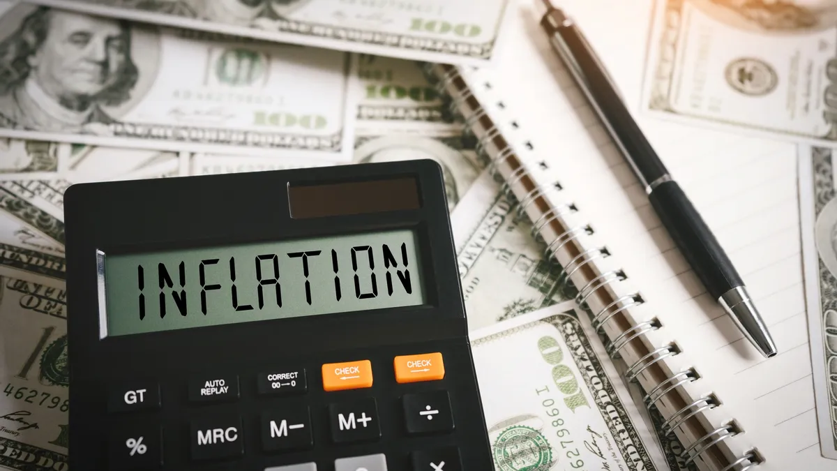 Inflation word on calculator in idea for FED consider interest rate hike