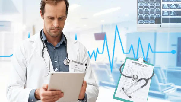person looking at clipboard in hand